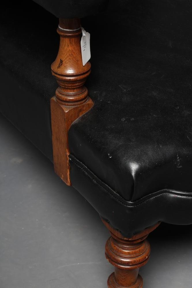 A VICTORIAN GOLDEN OAK CLUB ARMCHAIR upholstered in black leatherette Image