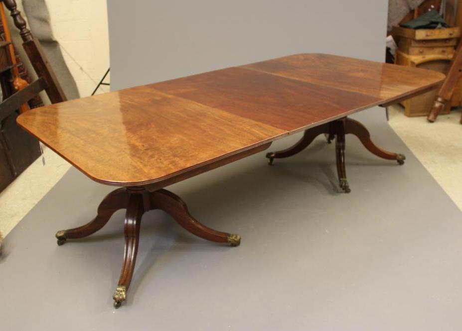 A VICTORIAN MAHOGANY EXTENDING TWIN PEDESTAL DINING TABLE Image