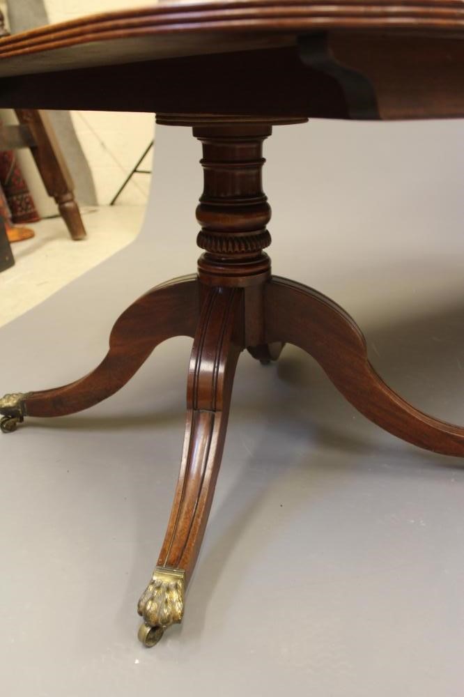 A VICTORIAN MAHOGANY EXTENDING TWIN PEDESTAL DINING TABLE Image