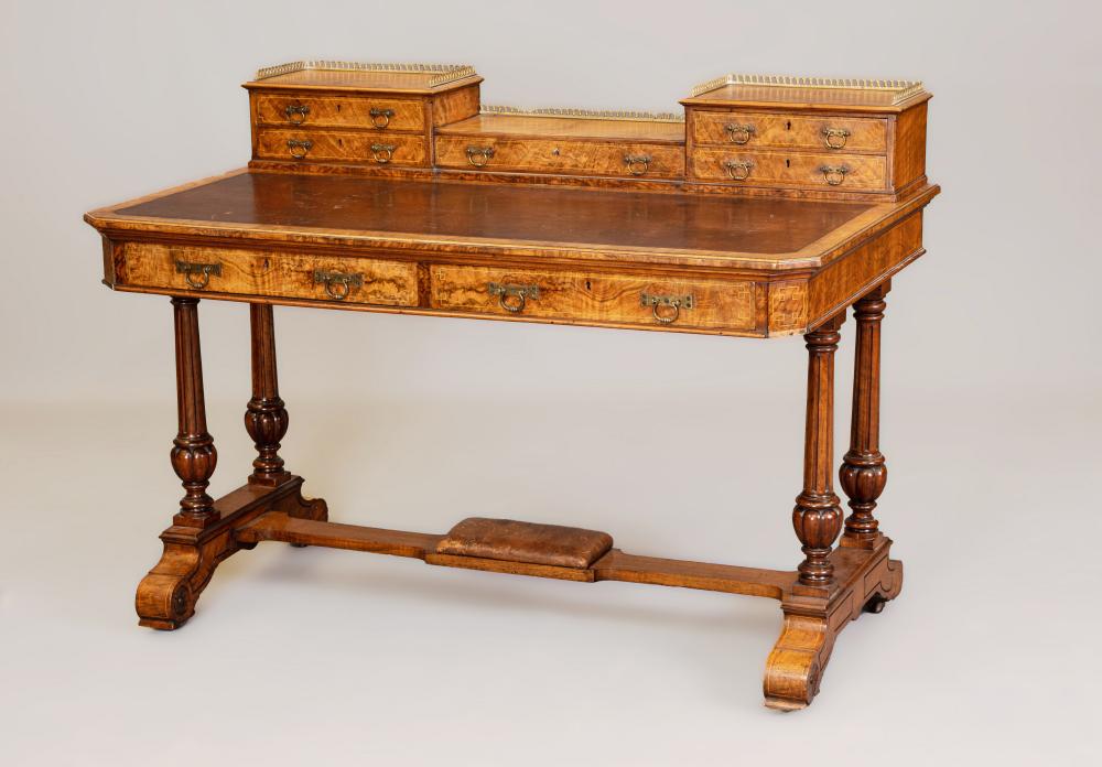 A VICTORIAN BURR WALNUT WRITING TABLE of canted oblong form with stringing and inset with brown Image