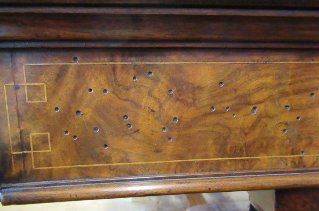 A VICTORIAN BURR WALNUT WRITING TABLE of canted oblong form with stringing and inset with brown Image