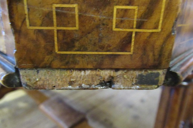 A VICTORIAN BURR WALNUT WRITING TABLE of canted oblong form with stringing and inset with brown Image