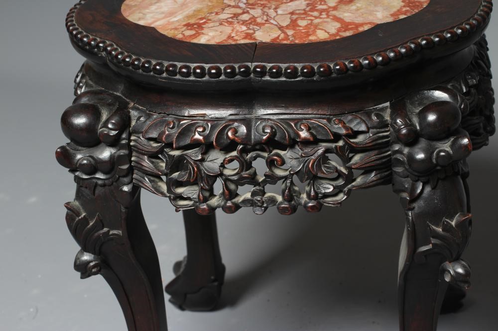 A CHINESE PADOUK WOOD JARDINIERE STAND Image