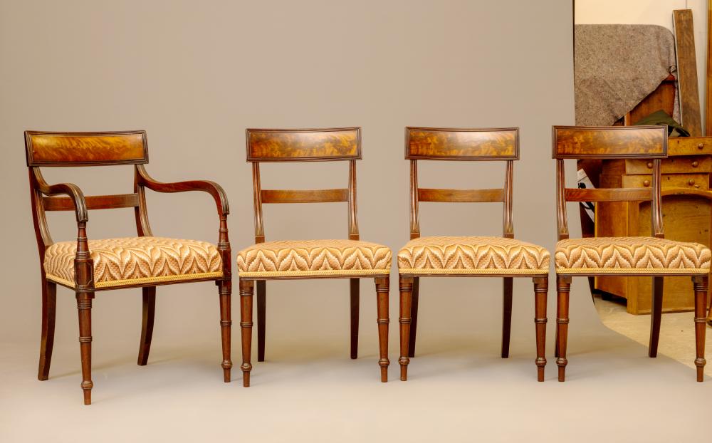 A SET OF EIGHT REGENCY MAHOGANY DINING CHAIRS with ebony stringing and including two elbow chairs Image