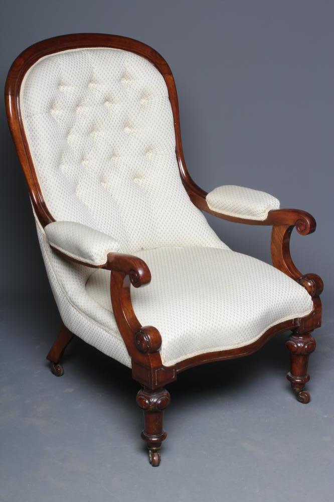 A VICTORIAN MAHOGANY ARMCHAIR button upholstered in an ivory weave Image
