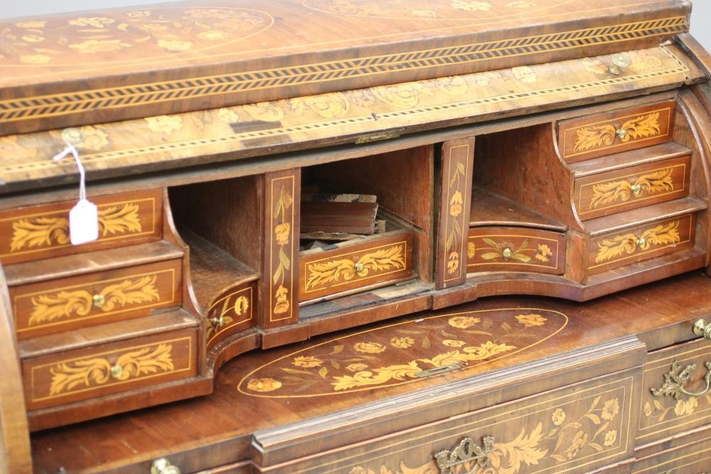 A DUTCH MAHOGANY AND FLORAL MARQUETRY CYLINDER BUREAU Image