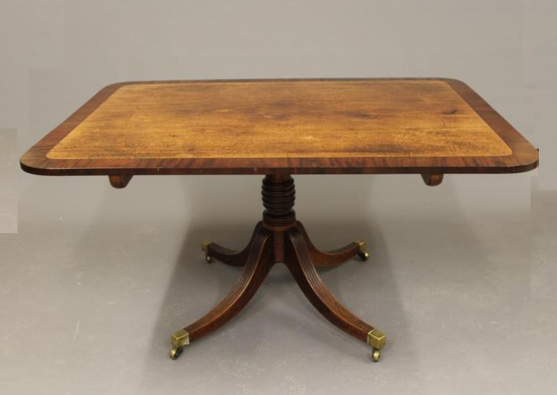 A MAHOGANY BREAKFAST TABLE Image