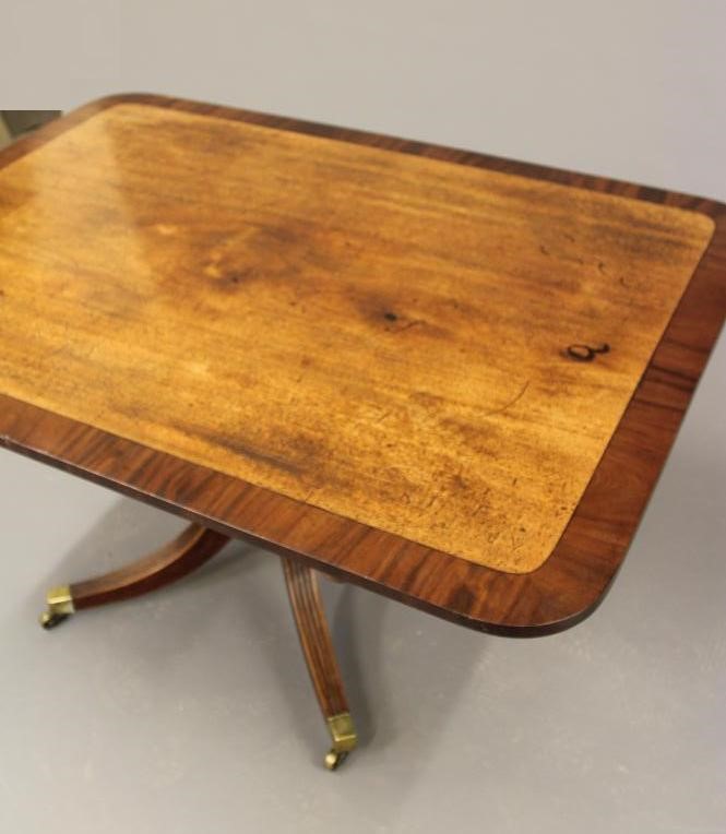 A MAHOGANY BREAKFAST TABLE Image