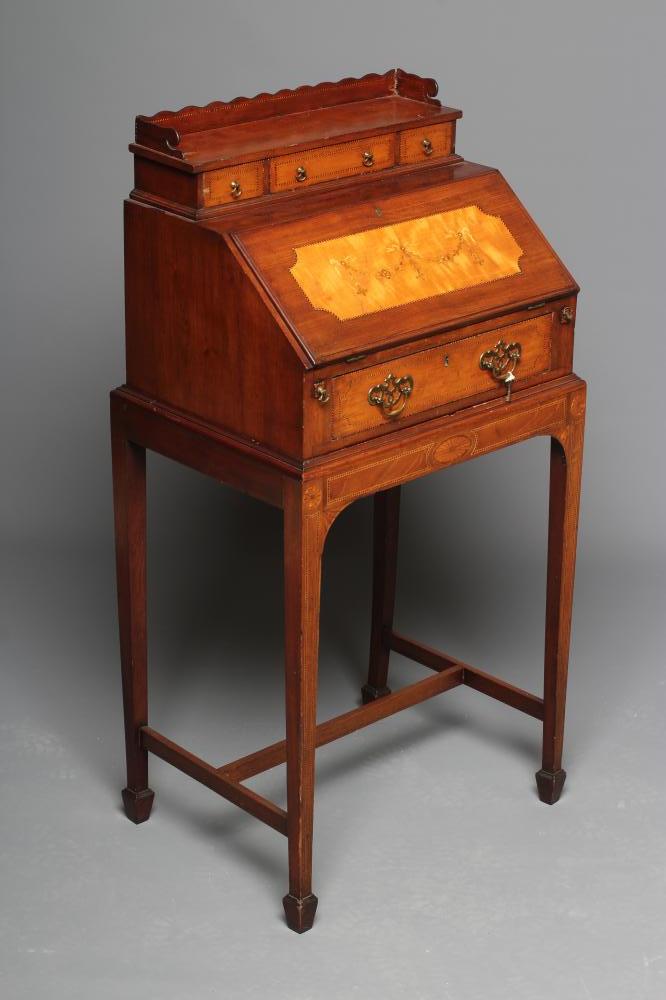 A SMALL EDWARDIAN MAHOGANY BONHEUR DU JOUR with chequer stringing and inlaid paterae Image