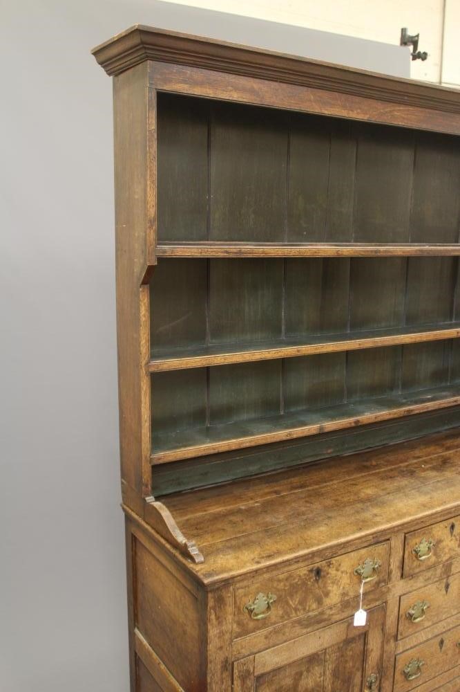 A GEORGIAN OAK ENCLOSED DRESSER Image