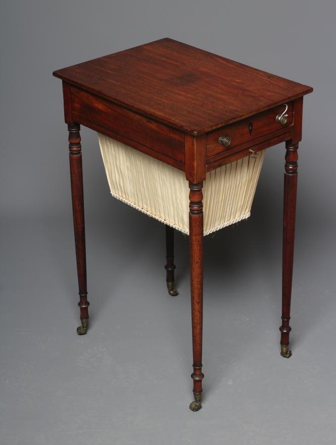 A REGENCY MAHOGANY WORK TABLE of oblong form with ebony stringing Image
