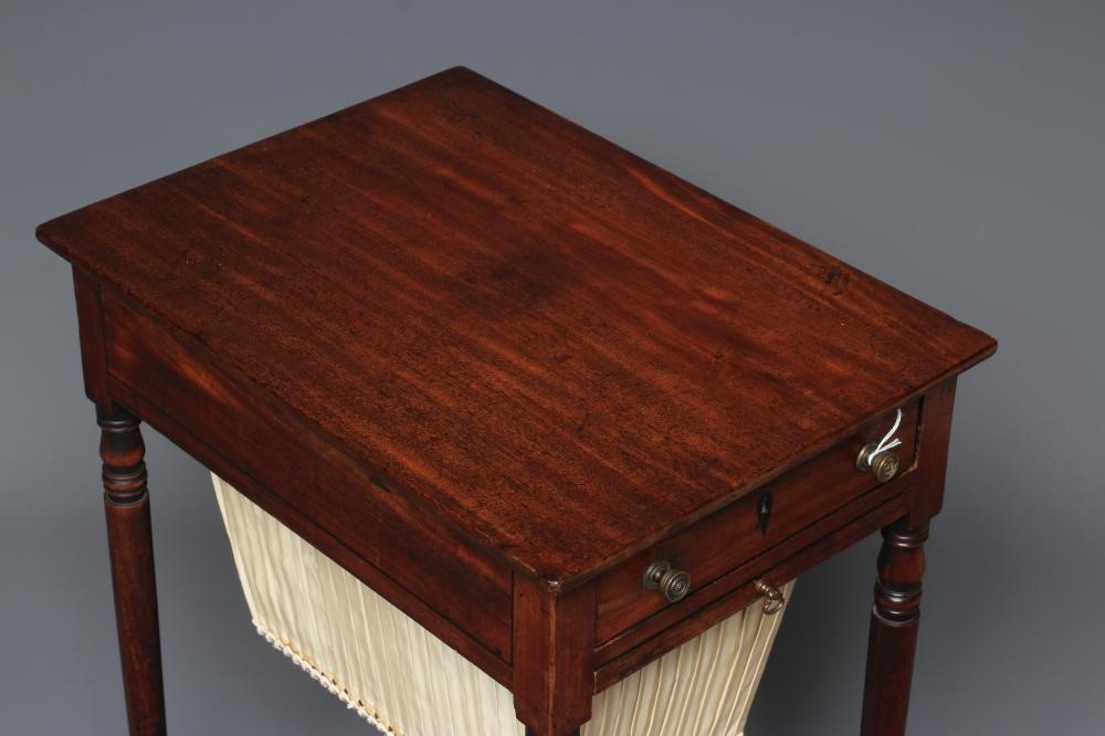 A REGENCY MAHOGANY WORK TABLE of oblong form with ebony stringing Image