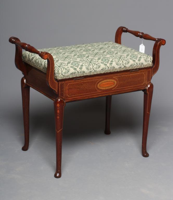 AN EDWARDIAN MAHOGANY PIANO STOOL of oblong form with stringing Image
