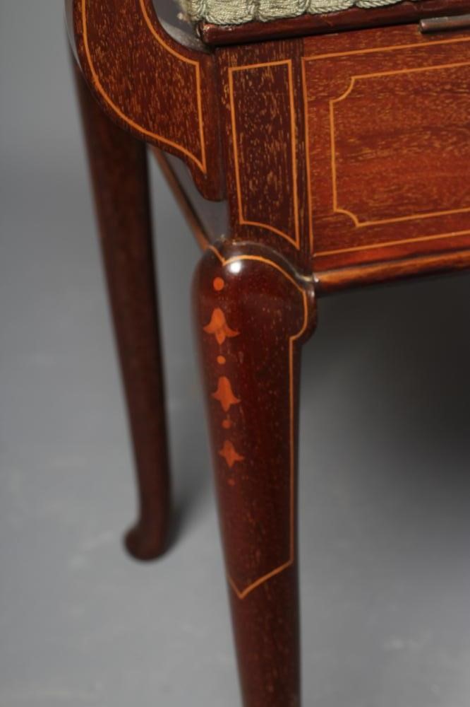 AN EDWARDIAN MAHOGANY PIANO STOOL of oblong form with stringing Image