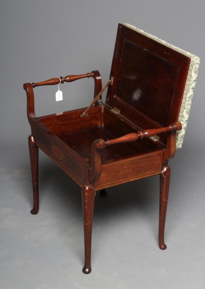 AN EDWARDIAN MAHOGANY PIANO STOOL of oblong form with stringing Image