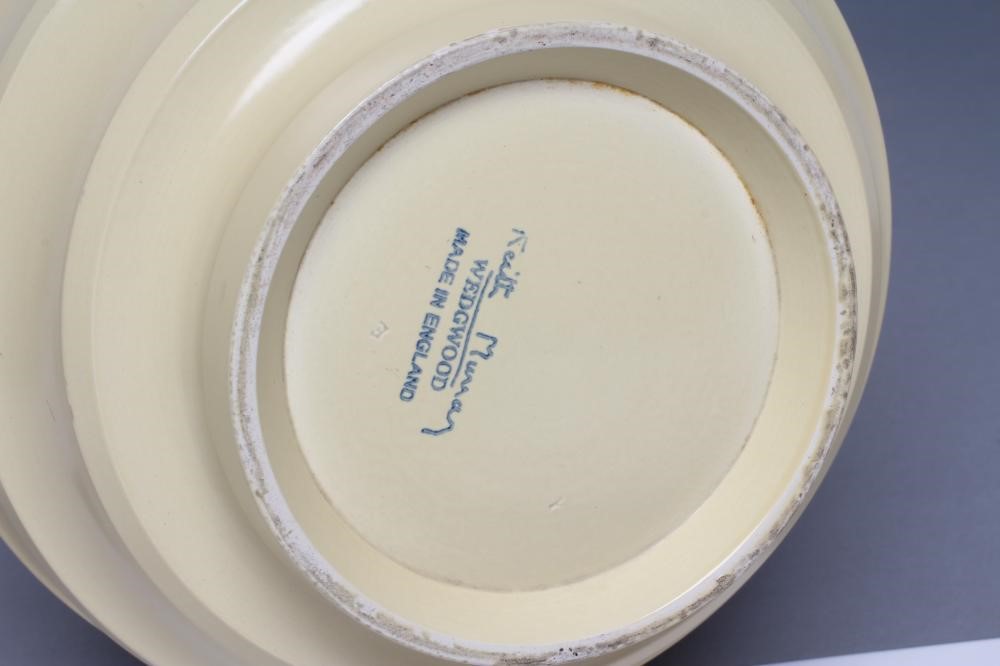 KEITH MURRAY FOR WEDGWOOD - a cream glazed earthenware vase of ribbed spherical form Image