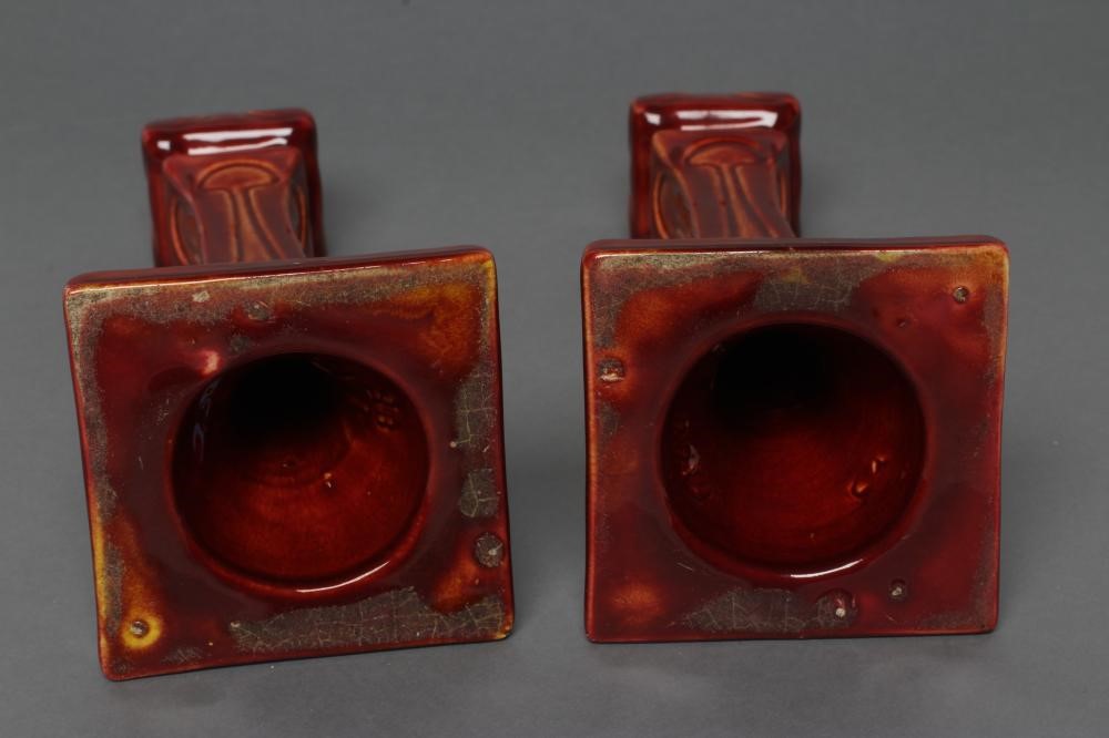 A PAIR OF BURMANTOFTS FAIENCE SECESSIONIST STYLE CANDLESTICKS Image
