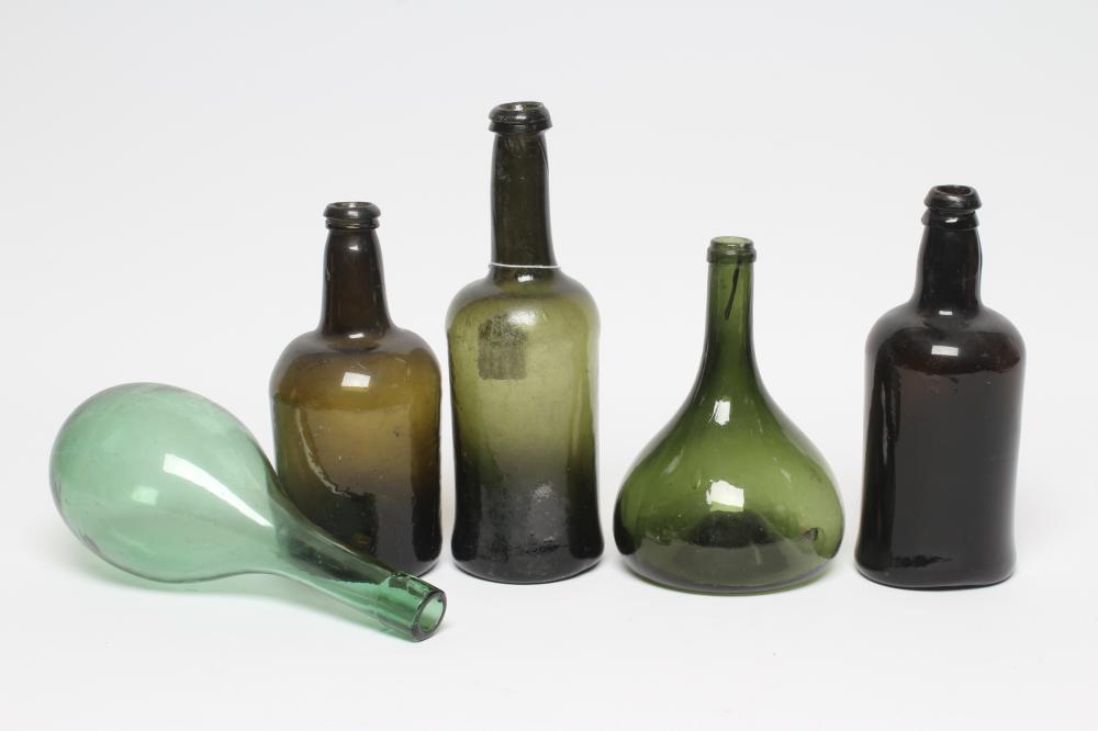 A COLLECTION OF GREEN GLASS WINE/SPIRIT BOTTLES Image
