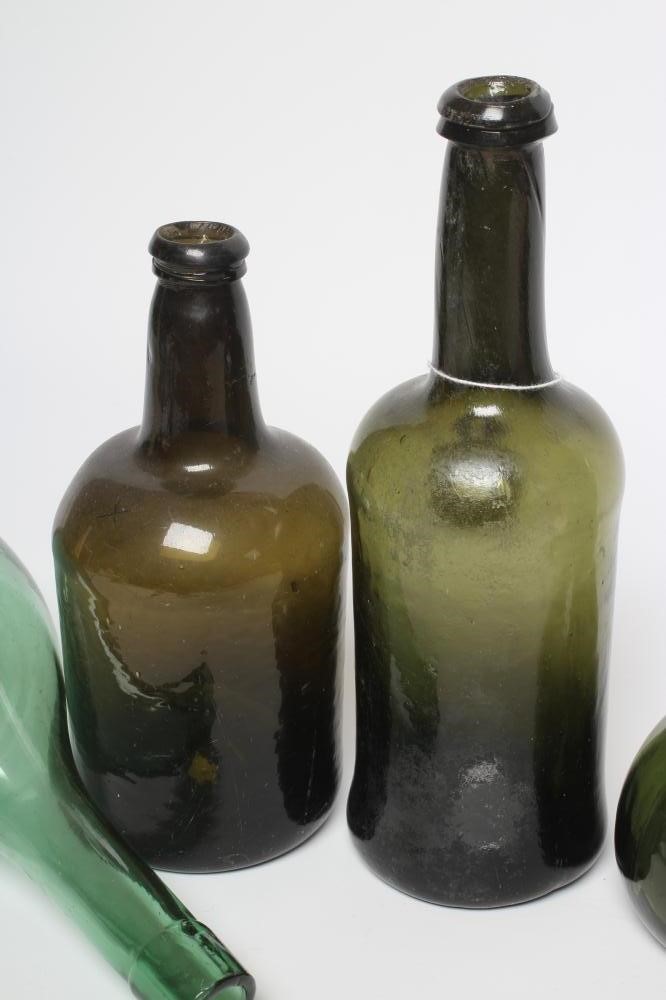 A COLLECTION OF GREEN GLASS WINE/SPIRIT BOTTLES Image