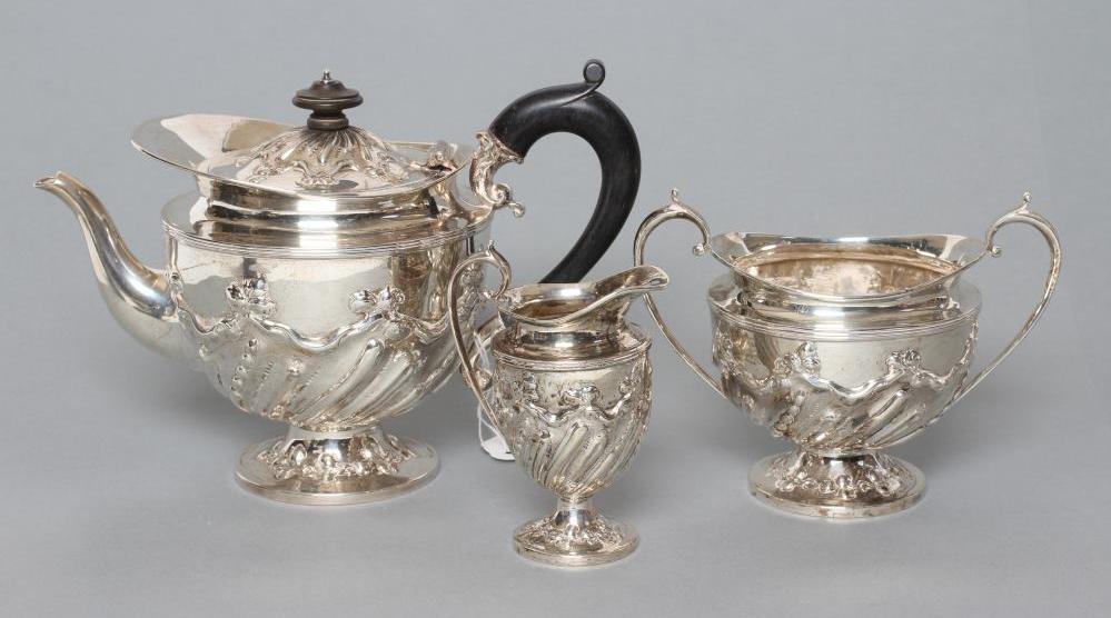 A LATE VICTORIAN SILVER THREE PIECE TEA SERVICE Image