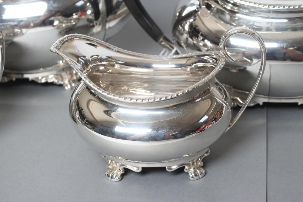 AN EDWARDIAN SILVER FOUR PIECE TEA AND COFFEE SERVICE Image