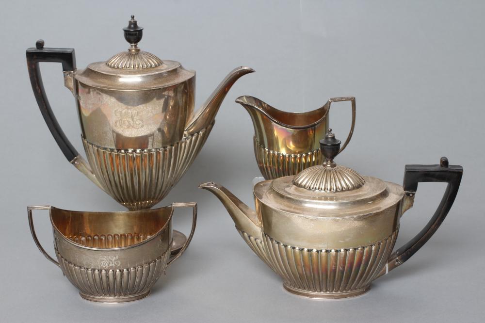 AN EDWARDIAN SILVER FOUR PIECE TEA AND COFFEE SERVICE Image