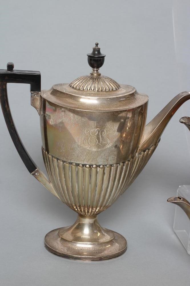 AN EDWARDIAN SILVER FOUR PIECE TEA AND COFFEE SERVICE Image