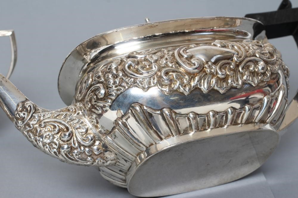 AN EDWARDIAN SILVER THREE PIECE TEA SERVICE Image