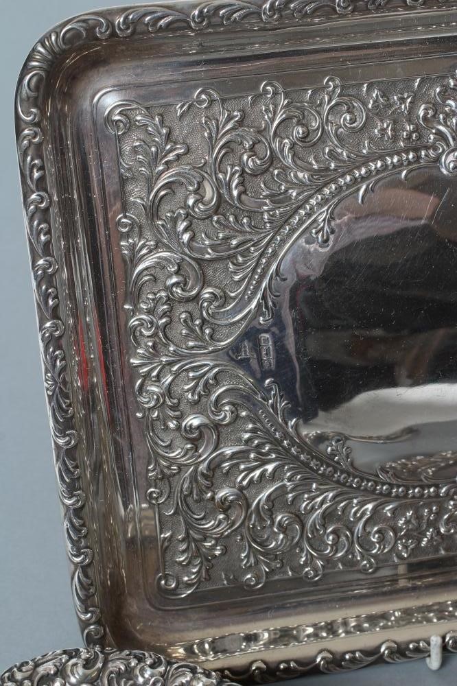 AN EDWARDIAN SILVER FOUR PIECE DRESSING TABLE SET Image