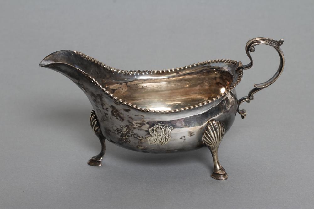 A GEORGE III SILVER SAUCEBOAT Image