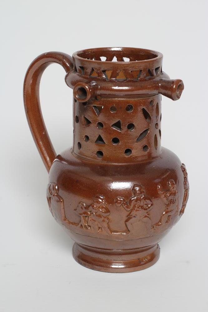 A VICTORIAN BROWN SALT GLAZED STONEWARE PUZZLE JUG of typical form with three spouts Image