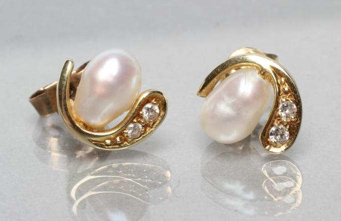 A PAIR OF PEARL AND DIAMOND EAR STUDS Image