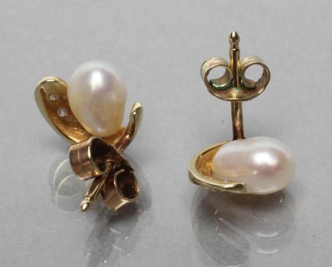 A PAIR OF PEARL AND DIAMOND EAR STUDS Image