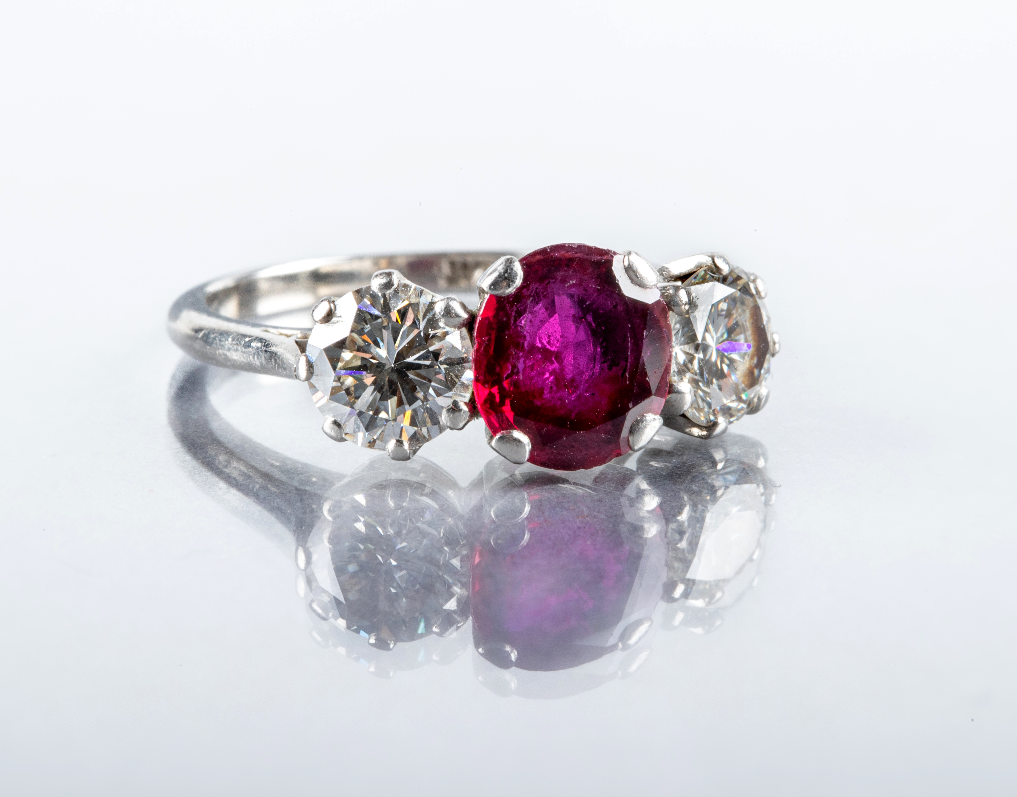 A THREE STONE RUBY AND DIAMOND RING Image