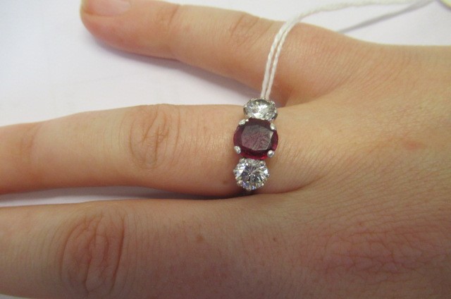 A THREE STONE RUBY AND DIAMOND RING Image