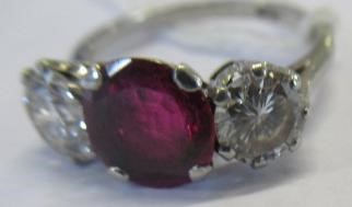 A THREE STONE RUBY AND DIAMOND RING Image