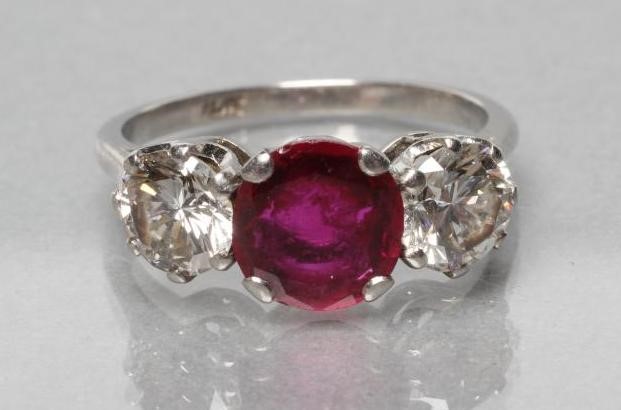 A THREE STONE RUBY AND DIAMOND RING Image