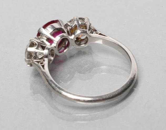 A THREE STONE RUBY AND DIAMOND RING Image