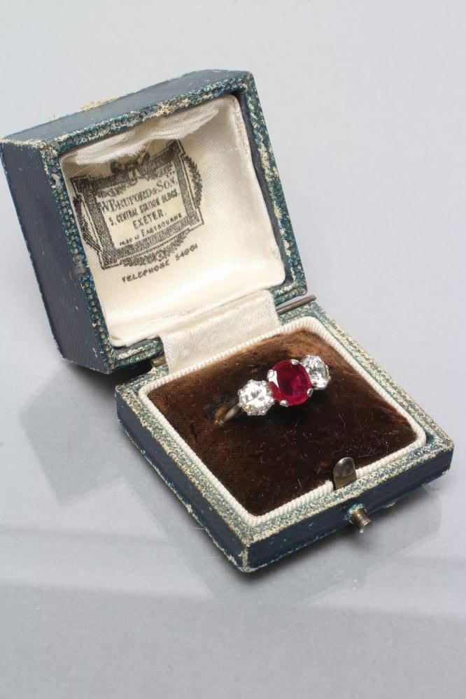 A THREE STONE RUBY AND DIAMOND RING Image
