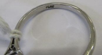 A THREE STONE RUBY AND DIAMOND RING Image