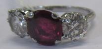 A THREE STONE RUBY AND DIAMOND RING Image