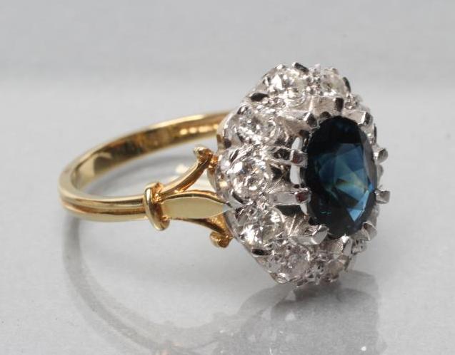 A SAPPHIRE AND DIAMOND CLUSTER RING Image