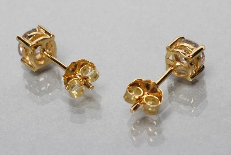 A PAIR OF DIAMOND SOLITAIRE EAR STUDS Image