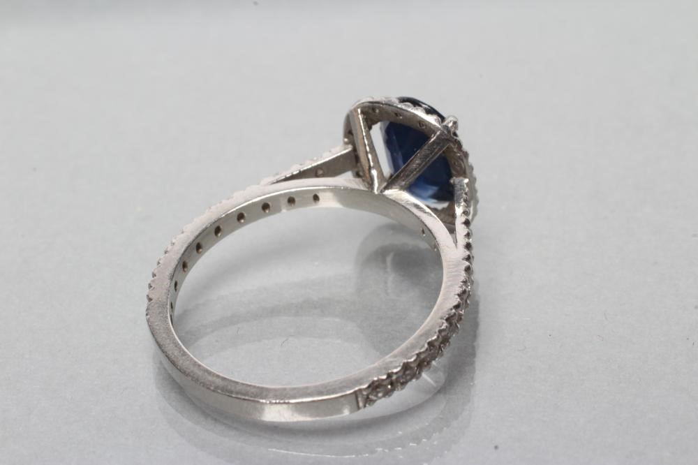 A SAPPHIRE AND DIAMOND CLUSTER RING Image