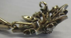 AN EDWARDIAN DIAMOND FLOWER PENDANT Image