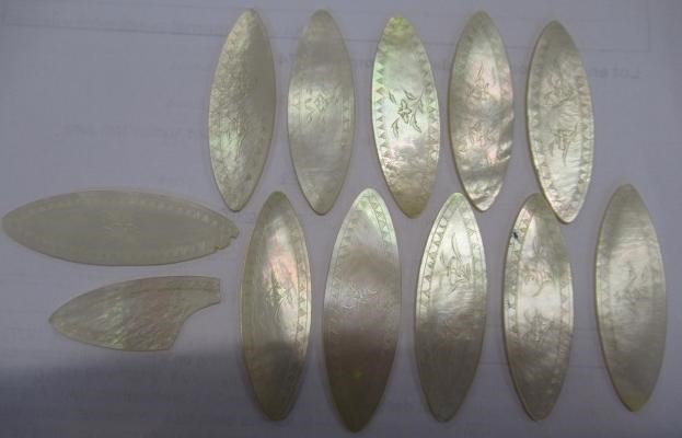 A COLLECTION OF CHINESE MOTHER OF PEARL GAMING COUNTERS including six oblong with a coat of arms and Image