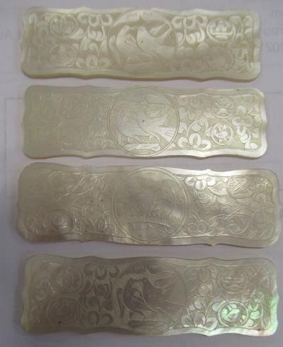 A COLLECTION OF CHINESE MOTHER OF PEARL GAMING COUNTERS including six oblong with a coat of arms and Image
