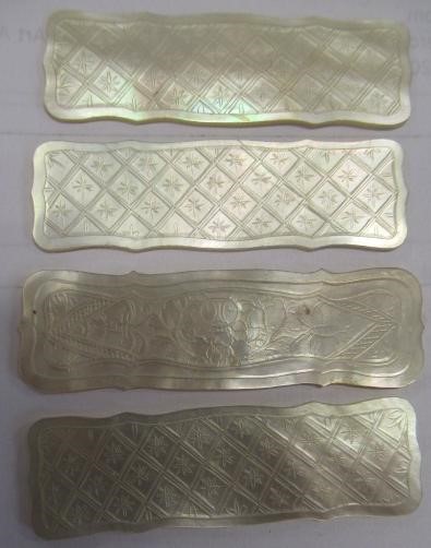 A COLLECTION OF CHINESE MOTHER OF PEARL GAMING COUNTERS including six oblong with a coat of arms and Image