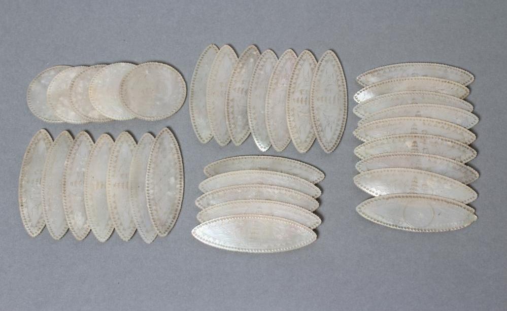 A COLLECTION OF CHINESE MOTHER OF PEARL GAMING COUNTERS comprising twenty eight eliptical panels Image