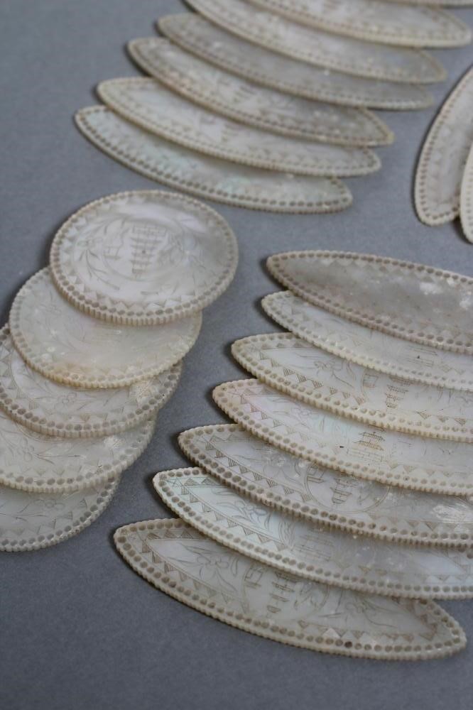 A COLLECTION OF CHINESE MOTHER OF PEARL GAMING COUNTERS comprising twenty eight eliptical panels Image